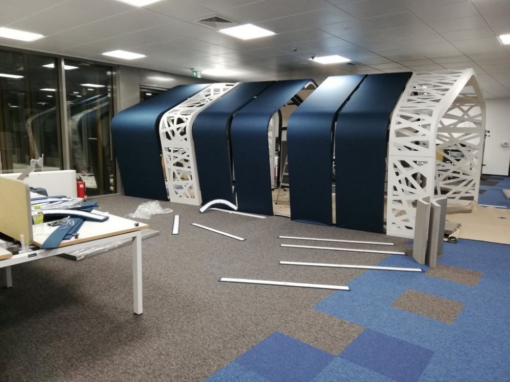 Custom acoustic treatment of an open-plan IT office
