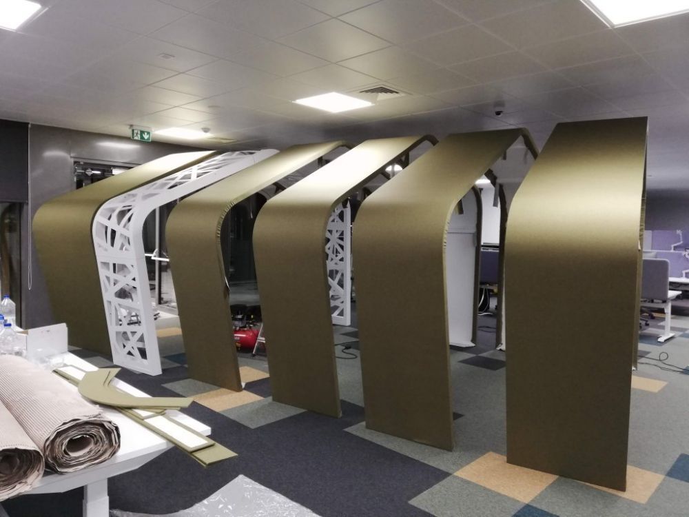 Custom acoustic treatment of an open-plan IT office
