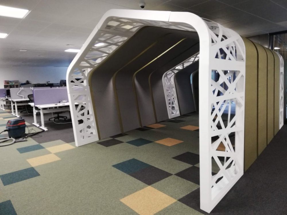 Custom acoustic treatment of an open-plan IT office
