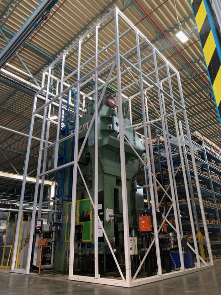 Soundproof enclosure for a large punch press within the Miba factory in Slovakia