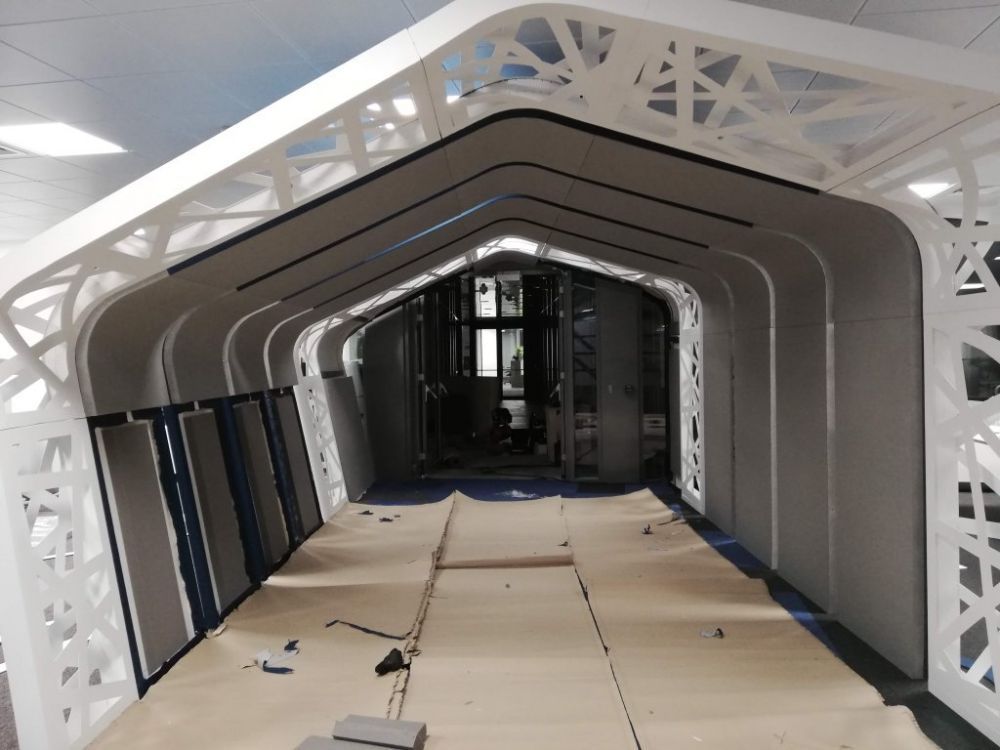 Custom acoustic treatment of an open-plan IT office
