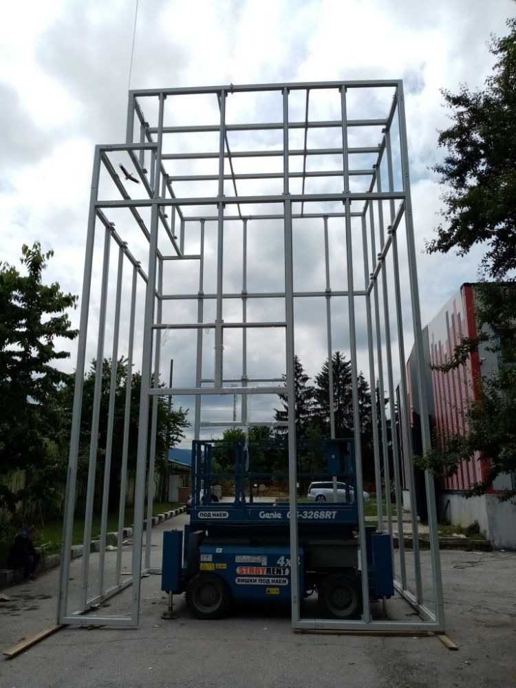 Soundproof enclosure for a large punch press within the Miba factory in Slovakia