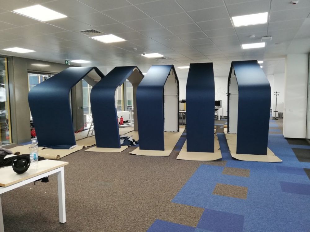 Custom acoustic treatment of an open-plan IT office