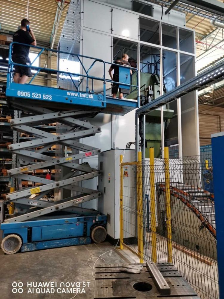 Soundproof enclosure for a large punch press within the Miba factory in Slovakia