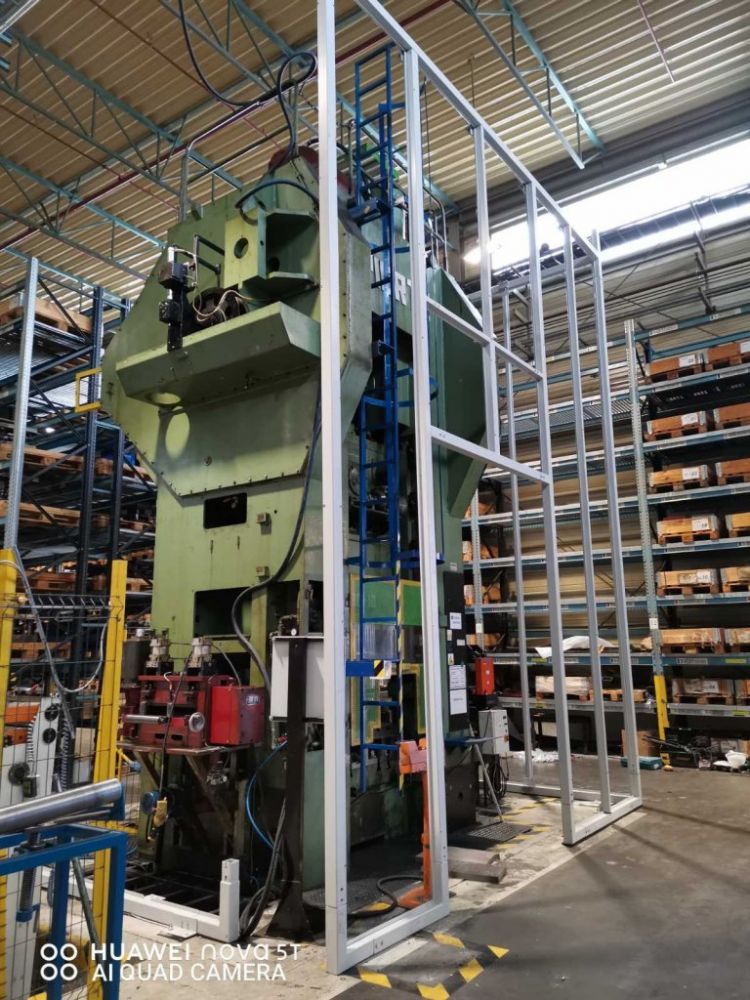 Soundproof enclosure for a large punch press within the Miba factory in Slovakia