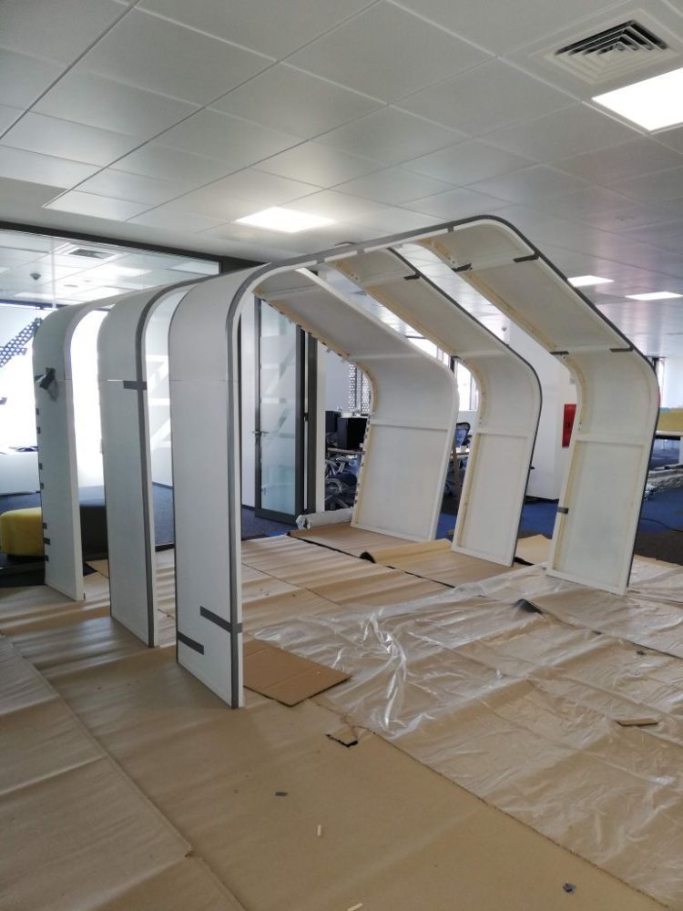 Custom acoustic treatment of an open-plan IT office