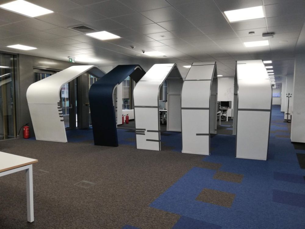 Custom acoustic treatment of an open-plan IT office