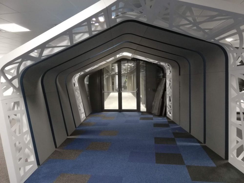 Custom acoustic treatment of an open-plan IT office