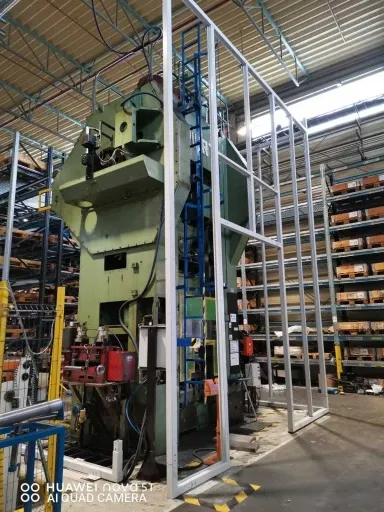Soundproof enclosure for a large punch press within the Miba factory in Slovakia
