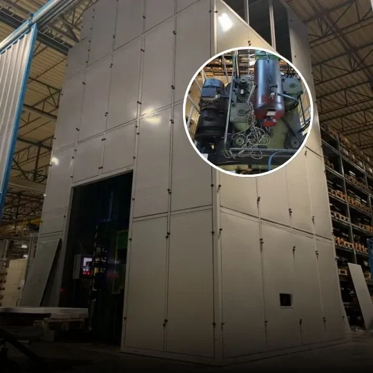 Soundproof enclosure for a large punch press within the Miba factory in Slovakia