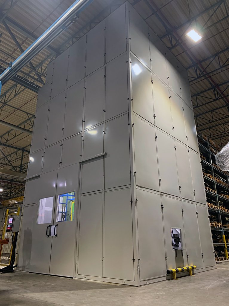 Soundproof enclosure for a large punch press within the Miba factory in Slovakia
