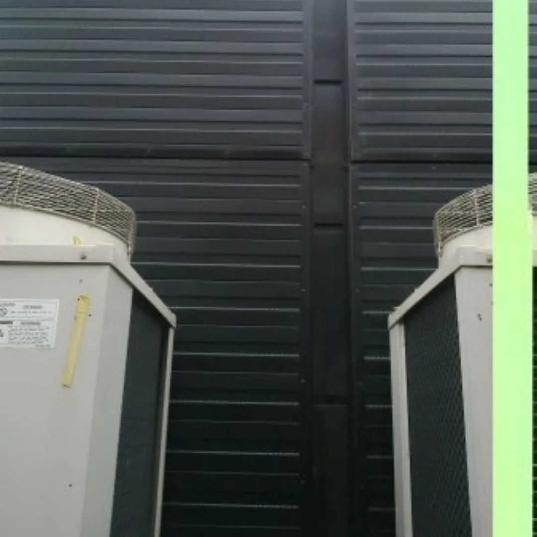 Sound-Absorbing Wall Panels Installed at Gym Near External AC Unit